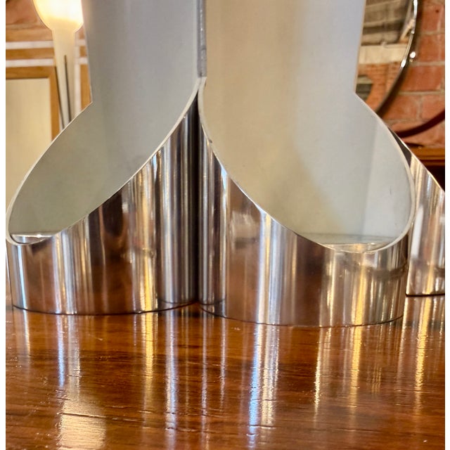 This sculptural table lamp is the model 14111 “Apollo”, designed by Angelo Lelli for Arredoluce in the early 1960s. It is...