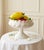 An exquisite 7-piece vintage table centerpiece featuring a classic Italian glazed ceramic pedestal compote bowl filled...