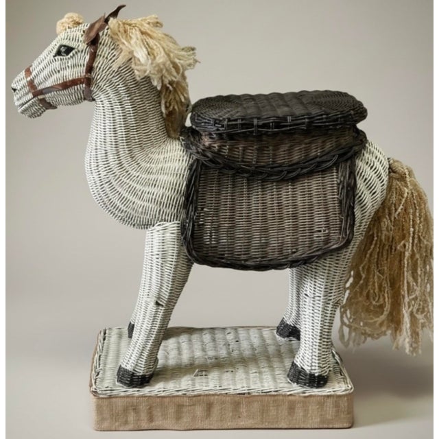 This is a rare find! It is a Hollywood Regency era wicker horse form side table. He features glass eyes and tortoise...