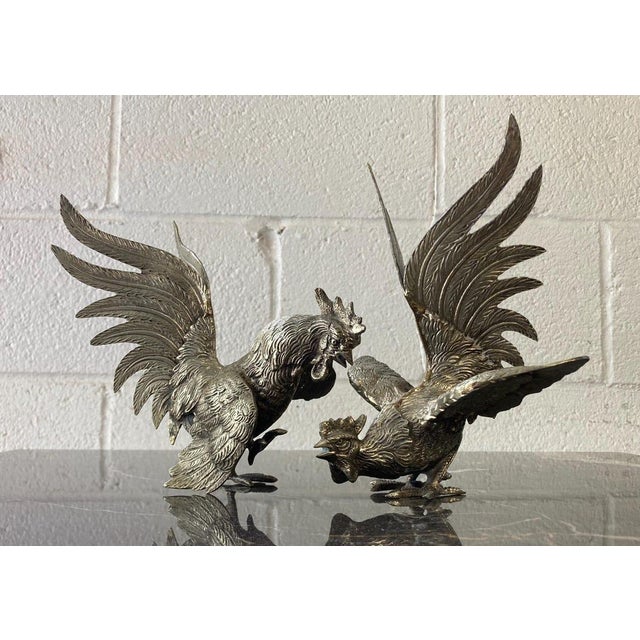 Set of 2 Vintage Silver Fighting Roosters Asian-inspired fighting roosters made of silver metal. Nice detail & action....
