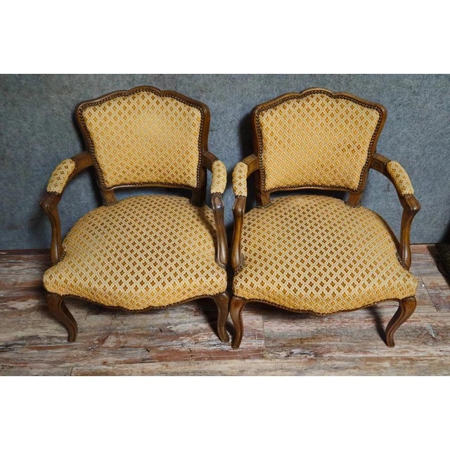 Pair of Antique Walnut Armchairs – Louis XV Style A beautiful pair of antique Louis XV style armchairs crafted from solid...