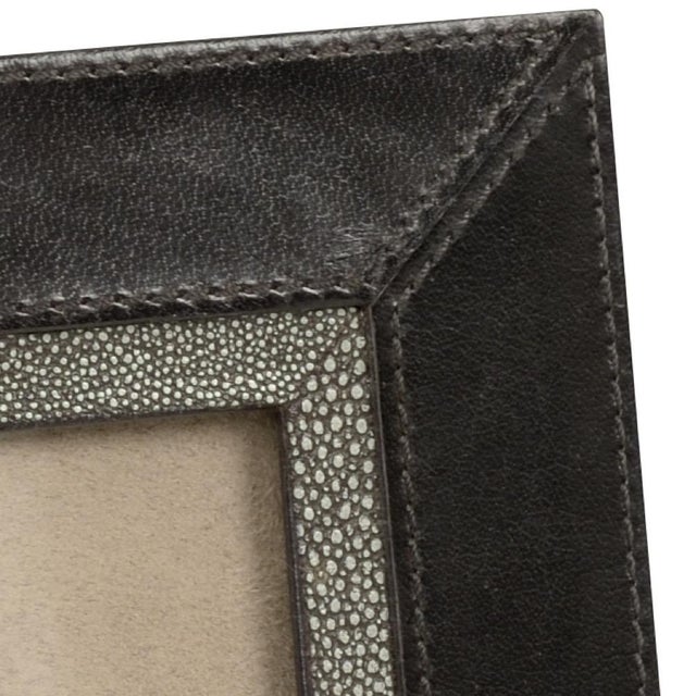Add a modern feel to your home or office with lawson photo frame. Featuring black leather with stitch detail and gray...