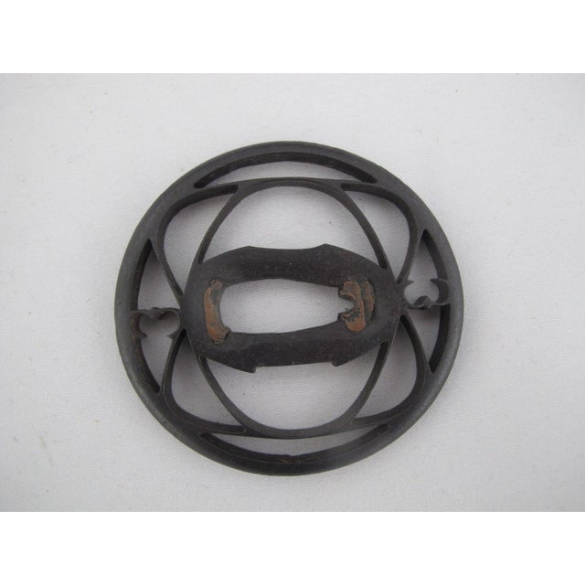 Japanese forged iron Tsuba, or sword guard, hand crafted in the restrained and functional style typical of the Kanayama...