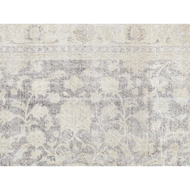 Handwoven wool-on-wool Oushak rug from vintage Turkey, measuring 6'9" x 10'4". Originating from the storied weaving...