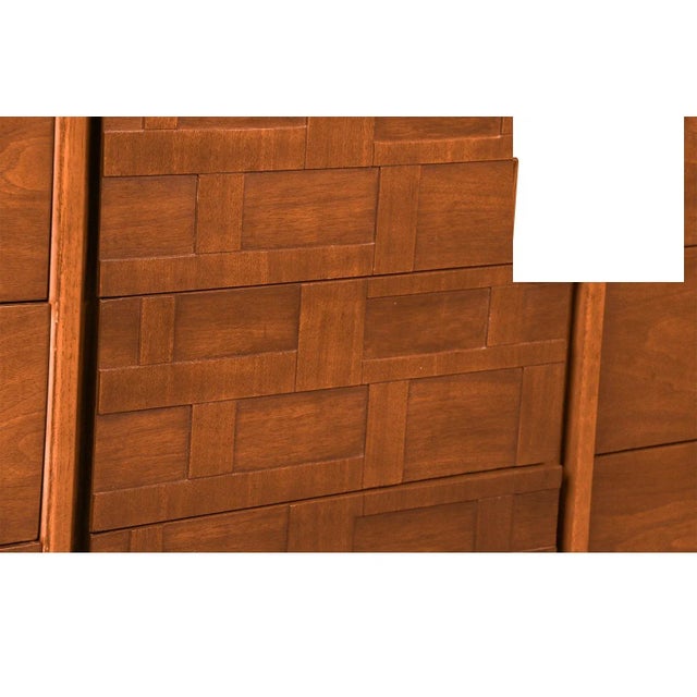 An elegant long nine drawer dresser. This is a beautiful example of Mid-Century craftsmanship. This retro piece was...