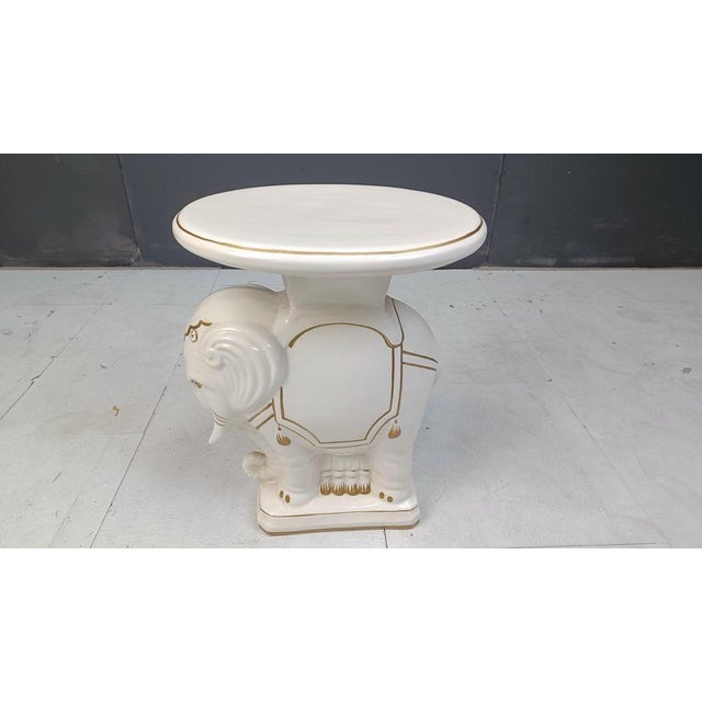 Very decorative mid century glazed ceramic elephant plant stand. Can also be used as little side table or just decor....