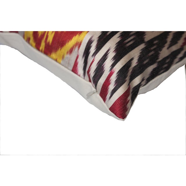 Bohemian silk ikat pillow with vibrant colors of red, beige and blue. Super hand soft. Pillow has a zipper for closure....