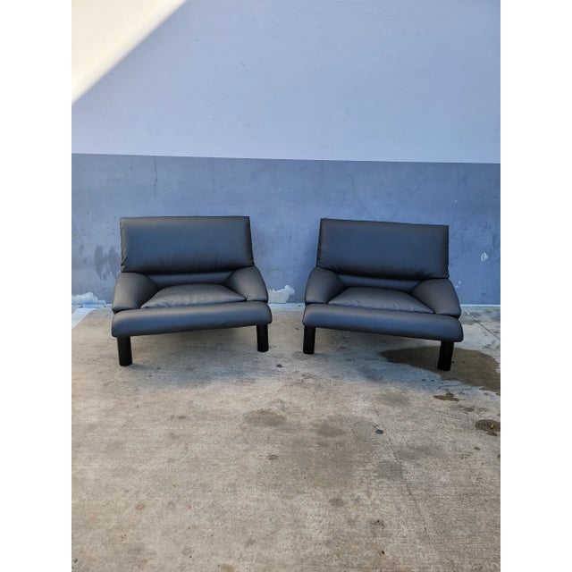 Italian Black Leather 1980's Saporiti Lounge Chairs - a Pair sold as found in vintage condition previously owned and used...