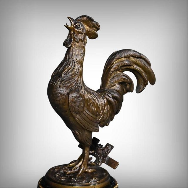 This bronze sculpture of a rooster crowing is the work of the sculptor Géo Guesnet, active at the end of the 19th century....