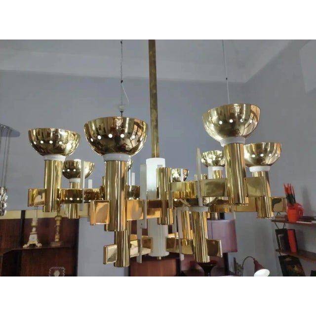 This chandelier captures the essence of mid-century modern lighting design, with its strong geometric forms, emphasis on...