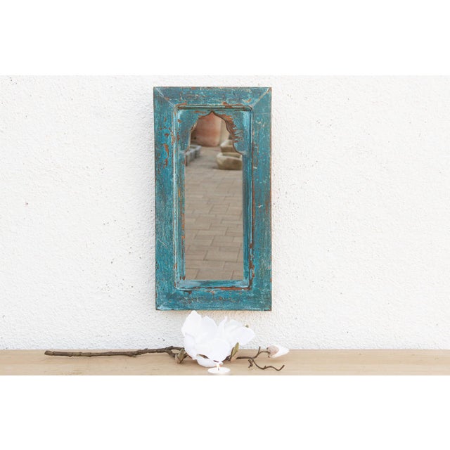 Bring the charm of old-world India into your home with this petite architectural mirror. Modeled after traditional...