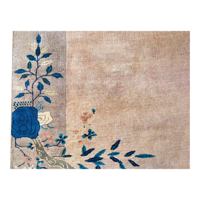 An early 20th century Chinese Art Deco rug with a tone-on-tone gray field surrounded by a wide gray border, and indigo...