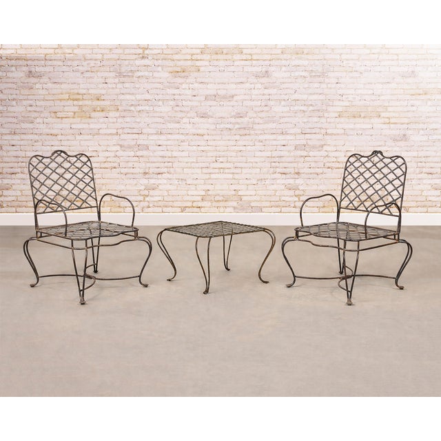Whimsical set of four iron patio and garden armchairs made in the style and manner of Rose Tarlow and Gregorius Pineo....