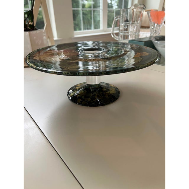 This elegant vintage pedestal cake stand features a rich botanical floral decoupage design embedded under clear, heavy...