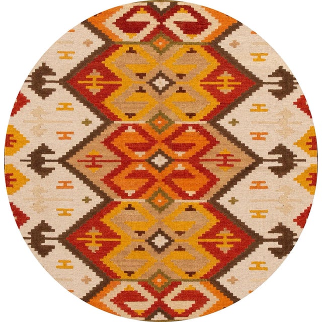 A beautiful hand-woven modern Kilim rug with a tan field and multi-color accents in an all-over geometric design. This rug...