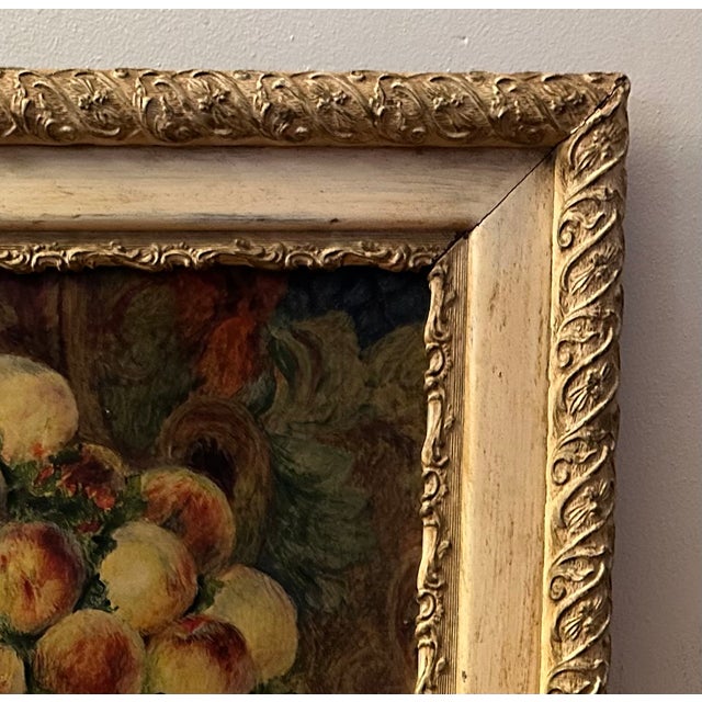 Beautiful 1920’s reproduction print of Pierre- Auguste Renoir’s “Still Life with Peaches”. Framed in an ornate wooden...