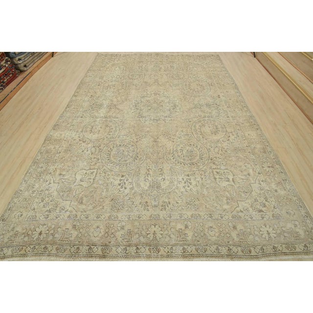 An authentic vintage traditional Tabriz rug hand-knotted with an all-wool pile on a cotton foundation. This oriental rug...