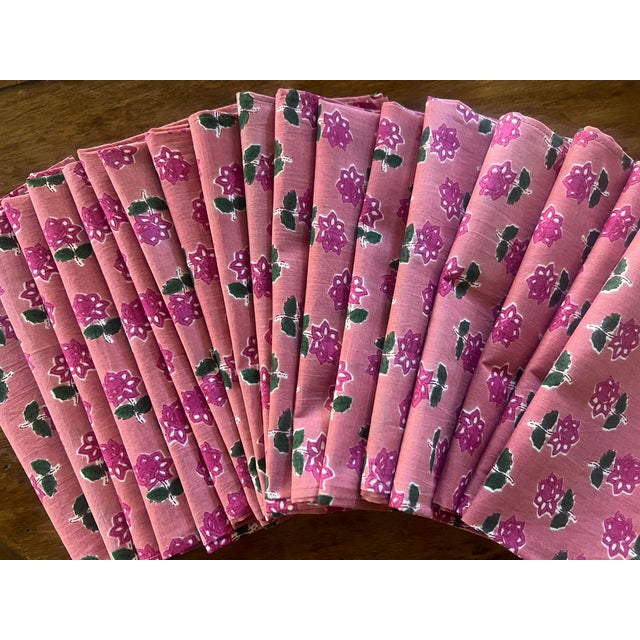 Newly made napkins made of 100% cotton woven in Jaipur India. The fun colorful pattern is fuscia flowers with green stems...