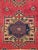 A finely woven vintage Turkish village runner from the early 20th century featuring a bold geometric medallion design...