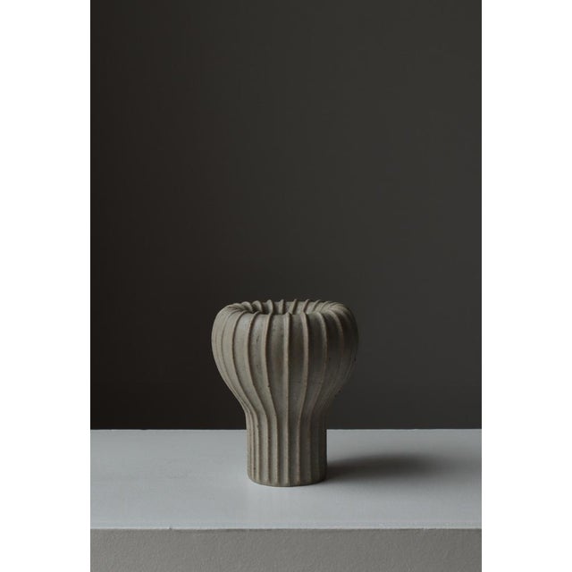 A sculptural Art Deco stoneware vase by Arne Bang, model 139, exemplifying the Danish master’s iconic organic modernism....