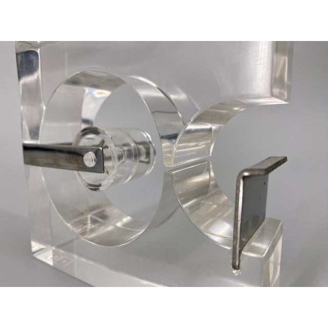 * Designed by Serge Mansau * For Fratelli Guzzini * Made of acrylic glass * Color: transparent * with chrome details *...