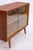 Vintage chest of drawers with delicate glass sliding doors and a slim base. The combination of open storage space and a...