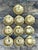 Elevate your tabletop with this radiant set of ten vintage clamshell dishes, a quintessential example of Hollywood Regency...
