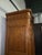 vintage reproduction of a French Provincial or Louis XV style armoire, antique. piece is characterized by a carved floral...