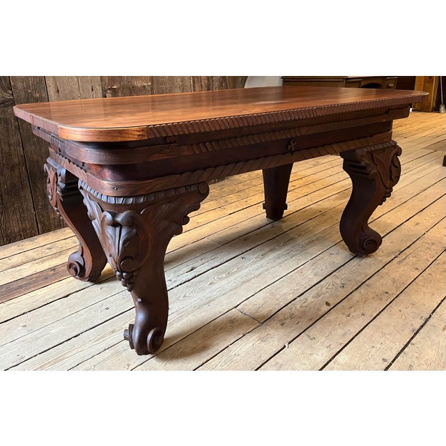 Large ornate American console table - heavy carved legs and detailing. It makes a very impressive appearance. I am unsure...
