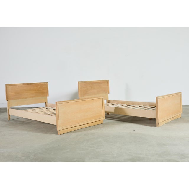 Gorgeous pair of twin size oak beds crafted from oak in the Scandinavian modern style. The oak frames feature a lightly...