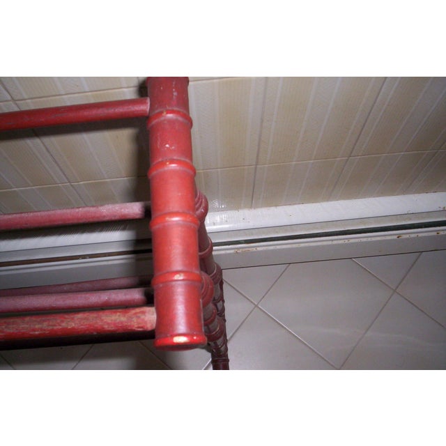 19th Century Victorian towel rack, red painted wood, turned legs in spool design, approx. 36" Wide x 24"High x 8"Deep. The...