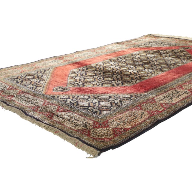 78187 Vintage Persian Silk Qum rug, 04'07 x 07'04. With its striking appeal and saturated red color palette, this hand-...