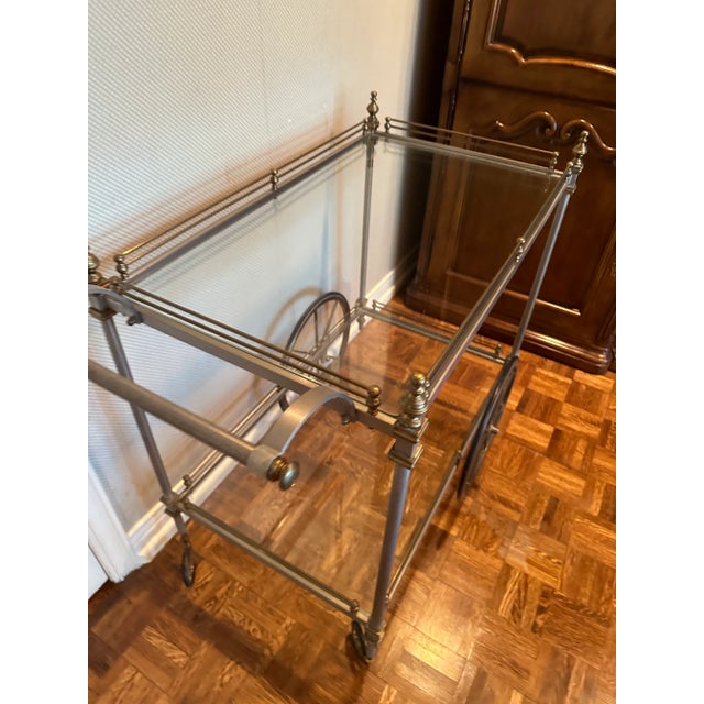 This elegant large bar cart is brass and steel, with two glass shelves. The wheels are rubber. The cart graced my...