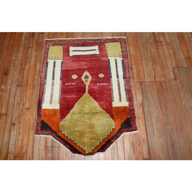 Unusual Turkish prayer rug used as a horseback cover, circa 1940. Measures: 3' x 3'6'' x 4'2''.