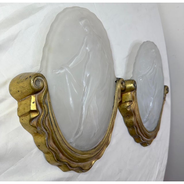 This antique pair of Muller Freres, Luniville bronze and frosted glass wall sconces fixtures date back to the first...