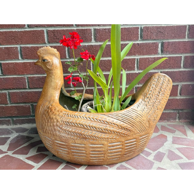 A large midcentury fiberglass planter cachepot sculpture of a folk art style hen in a terracotta finish. Beautiful filled...
