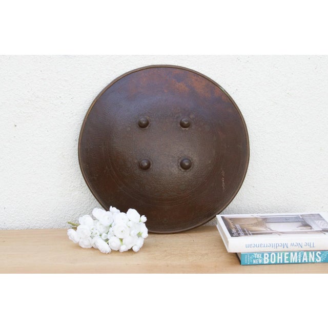 This striking round shield is a powerful talisman of protection and strength. Likely from India and dating to the early...