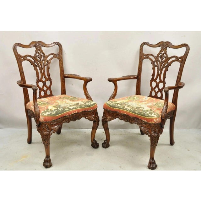 Maitland Smith Georgian Style Carved Mahogany Needlepoint Seat Dining Arm Chairs - a Pair. Item features figural...
