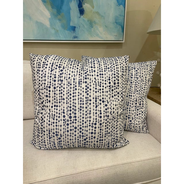 Transform your space with this pair of custom pillows featuring a charming blue dot chain pattern. Each pillow showcases a...