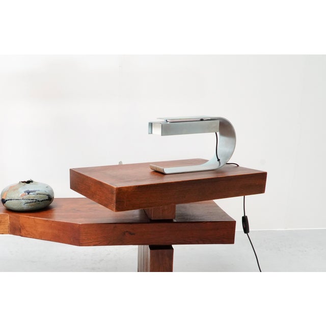 This iconic table lamp was designed in 1968 by Belgian designer Christophe Gevers for the Brussels brasserie 'Le Cap...