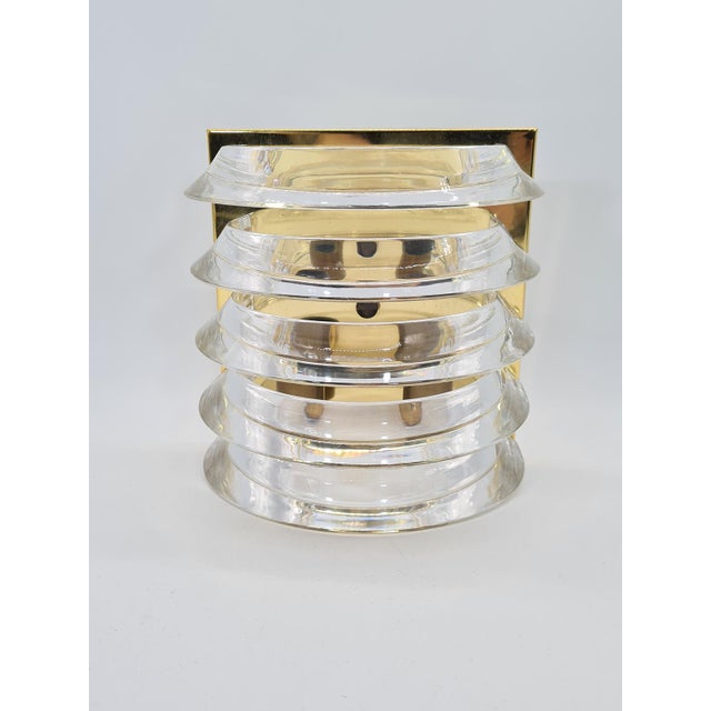 An original wall lamp manufactured by prometeusz (poland) in the 1980s. the model has a distinctive layered structure made...