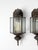 A pair of vintage outdoor wall lanterns with a classic Colonial Revival form, featuring clear glass panels and a softly...