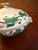 The Wedgwood Napoleon Ivy Queensware Covered Serving Bowl is a luxurious and elegant piece of bone china that adds a touch...