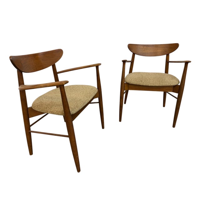 A beautiful pair of Mid-Century Modern Walnut & Oak Arm Chairs, circa 1960s, showcasing timeless Scandinavian-inspired...