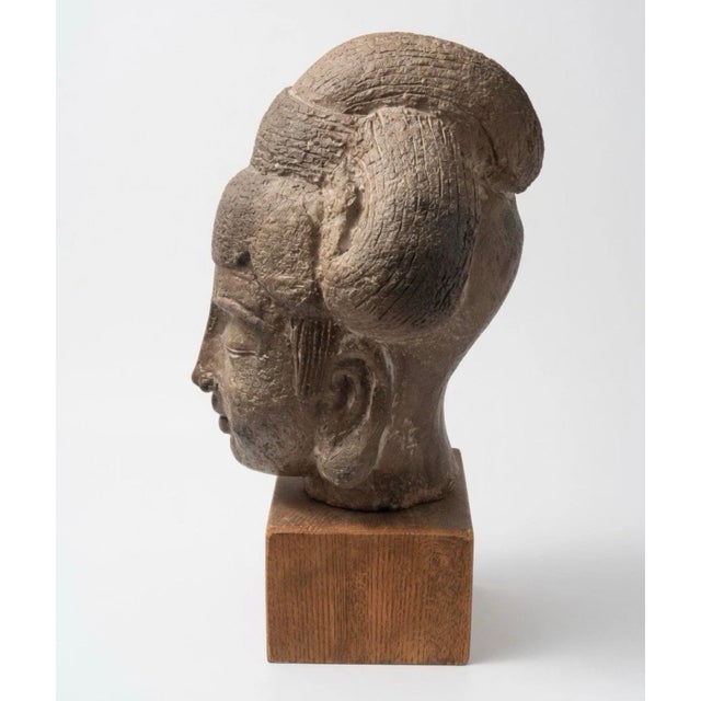 The Terracotta Burmese bodhisattva head from the 1600-1700's is a collectible statue representing a key figure in...