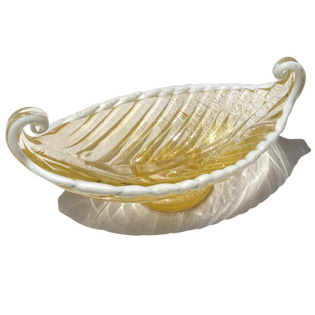 Beautiful vintage Murano hand blown gold flecks Italian art glass Venetian gondola shaped bowl. The bowl is documented to...