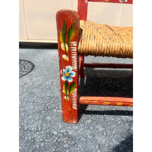 For your consideration we have one vintage Mexican Folk Art Children’s chair. Thoughtfully hand painted with a woven rush...