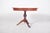 Round dining table with central leg, extendable. The structure is supported by a single central foot, turned in the shape...