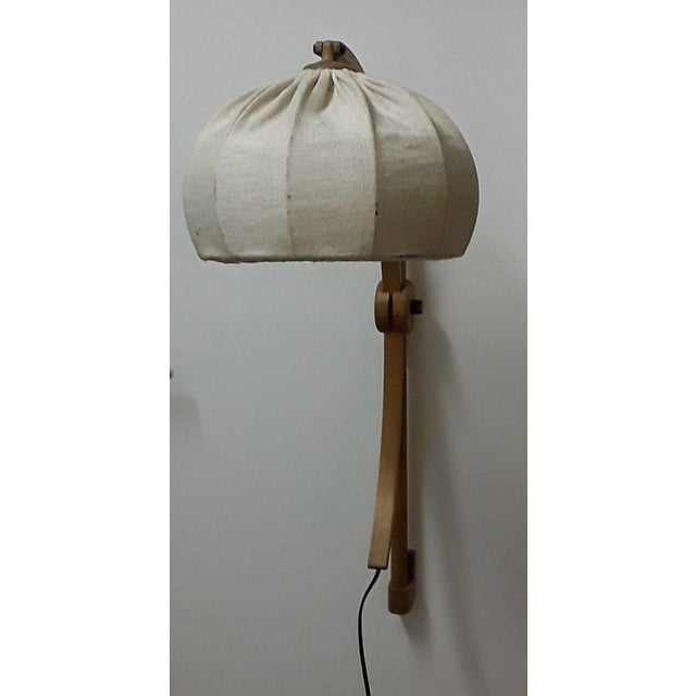 Light Oak Sconce with Beige Wool Shade, 1970s, in Good conditions. Designed 1970 to 1979 European Plug (up to 250V).The...