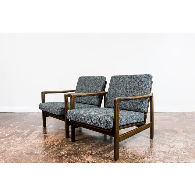 A pair of club chairs "type B7522," designed by Zenon Bączyk and produced in Poland in the 1960s, exemplifies the...